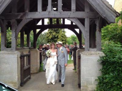 Bride and Groom leave through the Lych Gate